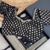 Elegant Black Banarasi saree with golden motifs and blouse