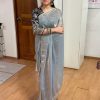 Model wearing Fendy Smooth Grey Saree with intricate blouse embroidery