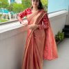 Smooth Red Saree with Embroidered Blouse laid out on white background